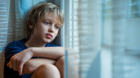 sad boy in a room