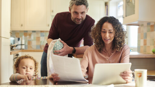 mom and dad filling out paperwork
