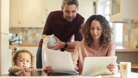 mom and dad filling out paperwork