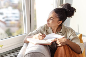 Woman sitting down writing