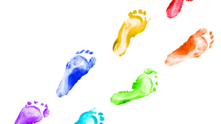 Rainbow foot prints kid colorful set isolated on white background. Many fingerprint or stamp texture artwork of kids for education and journey. Bottom view. Close up.