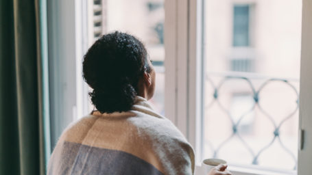 Woman looking out window