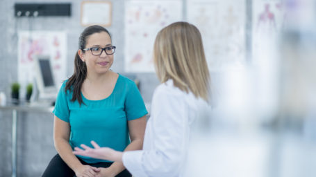 Woman consulting with her doctor