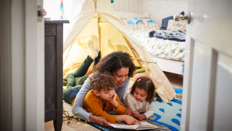 Mother Reading With Son And Daughter