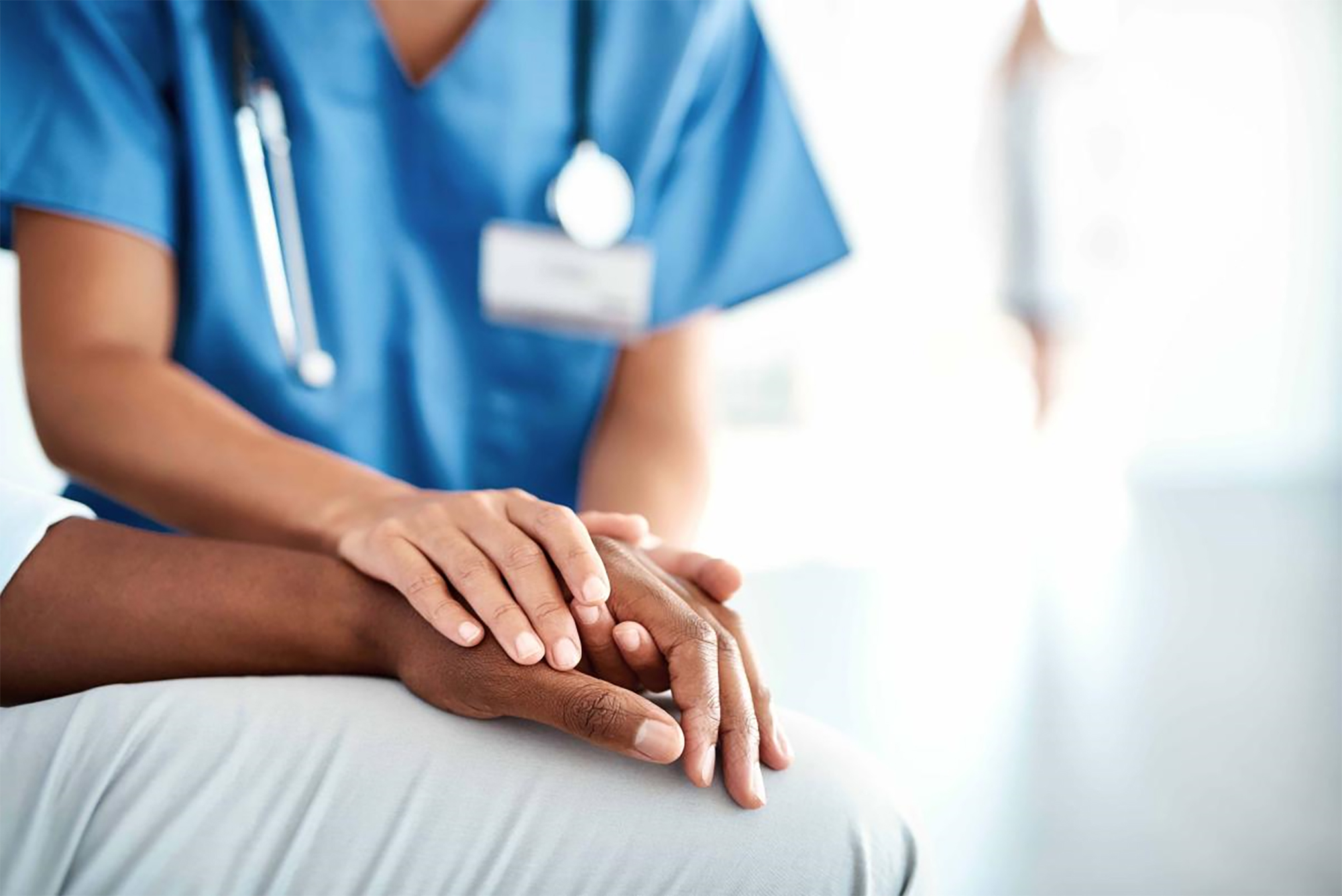 Nurse holding a patient hand