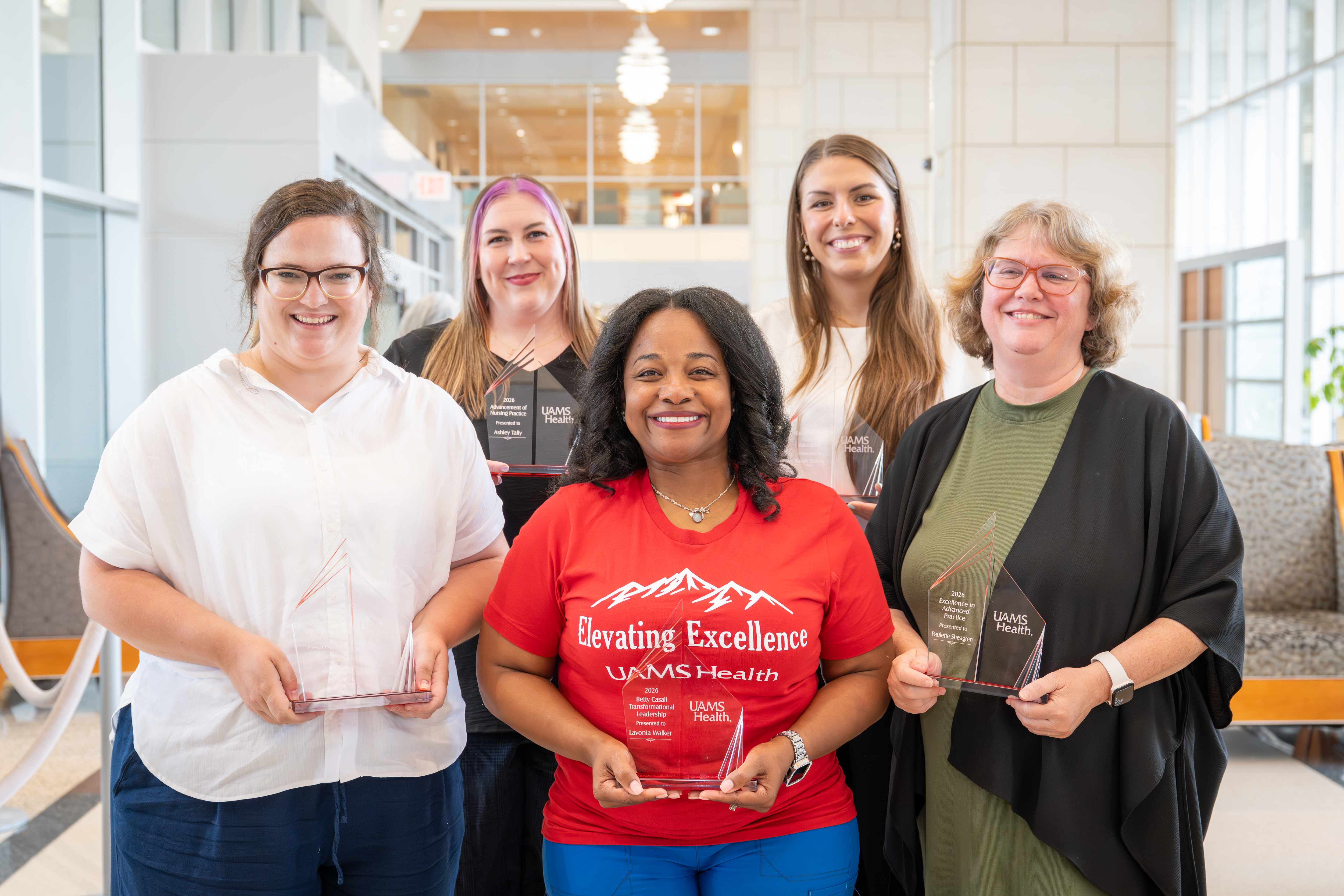Winners of the 2026 Professional Nursing Awards, Front row: Outstanding Community Service – Morgan Newsom, RN, Nurse Educator, COM OB/GYN ACWIH Community Health; Betty Casali Transformational Leadership – Lavonia Walker, RN, Assistant Nursing Director for PeriOp Service Patient Care; Excellence in Advanced Practice – Paulette Sheagren, APRN, Behavioral Health. Back row: Advancement of Nursing Practice – Ashley Tally, RN, UAMS East - Helena; Excellence in Nursing Education – Sarah Sixbey, RN, Nurse Educator, Maternal and Mobile Health.