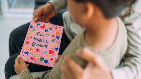 Patient receiving a get well card