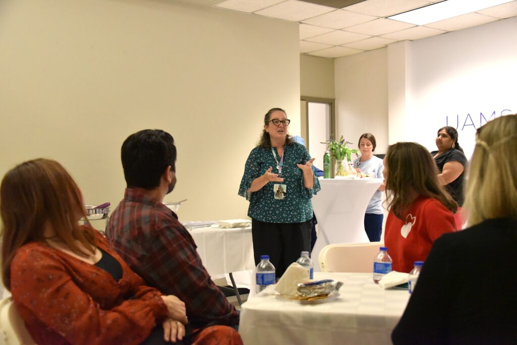 A UAMS Milk Bank representative speaking to a group.