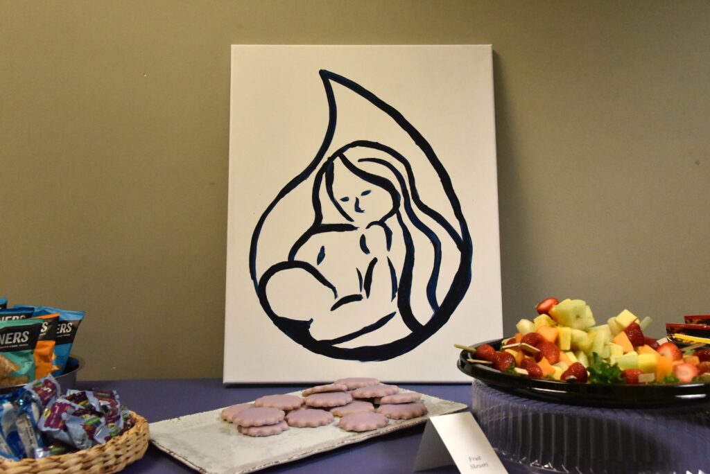 A painting of a Milk Bank logo.