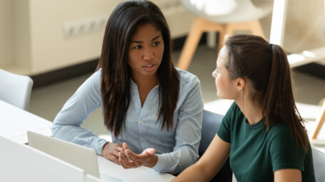 two women talking to each other