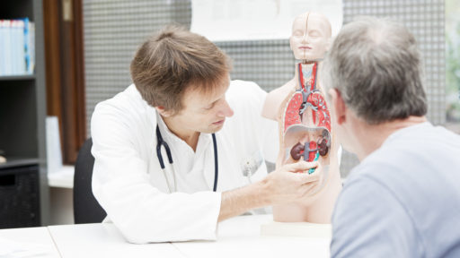 Image of a doctor explaining urological problems to a patient.