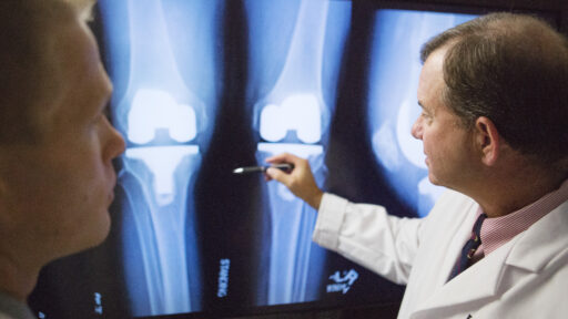 Dr. Barnes reviewing an X-ray of a joint