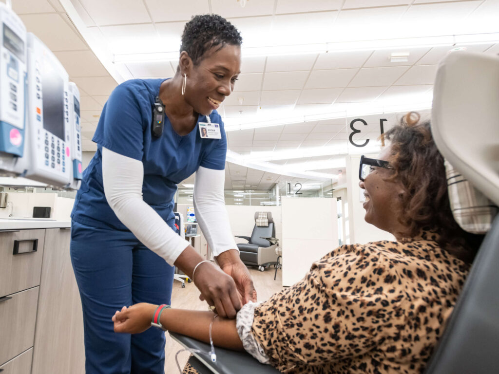 Patient receiving her treatment in the UAMS Baptist Health Infusion Center in Little Rock