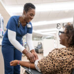 Patient receiving her treatment in the UAMS Baptist Health Infusion Center in Little Rock