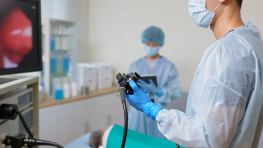 A doctor performing a colonoscopy