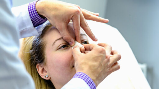Doctor checking a patient who underwent rhinoplasty.