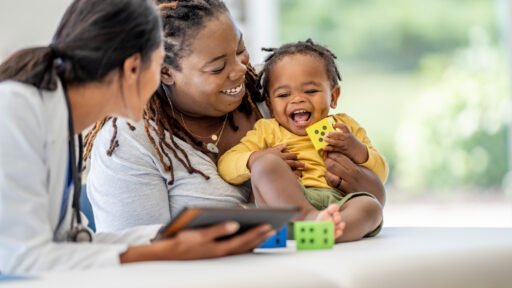 Baby with mom and doctor