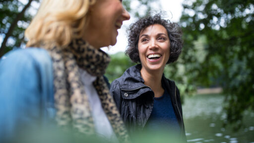 Two middle aged women taking a walk.