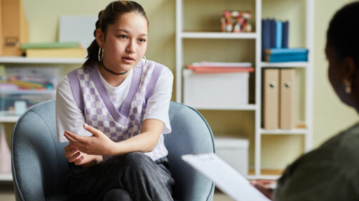 teen talking to a counselor.