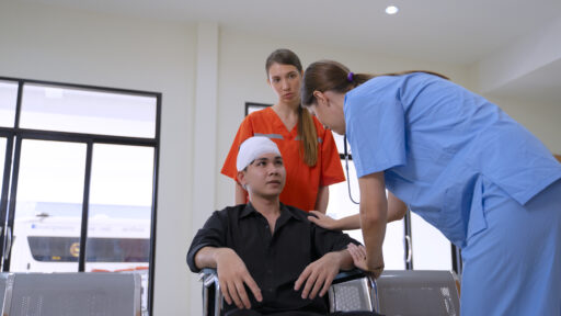Therapist helping with a brain injury patient