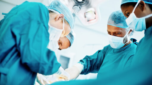 surgeons performing surgery