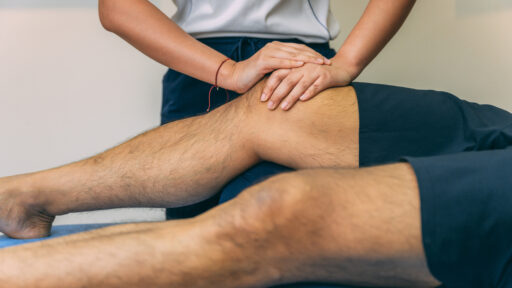 a PT working on knees
