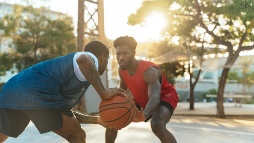 two men playing basketball