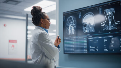 neurologist looking at an x-ray of the head