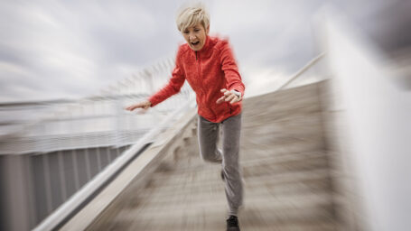 Senior woman falling down stone steps