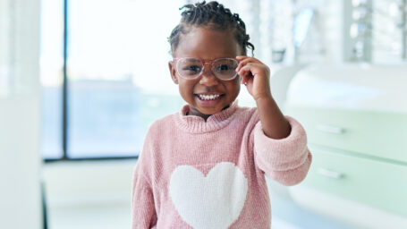 Shop, glasses and eyes of black child with vision healthcare, frame check or choice in retail with kids medical insurance. Eye care, store and african girl with lens for promotion sale. or marketing
