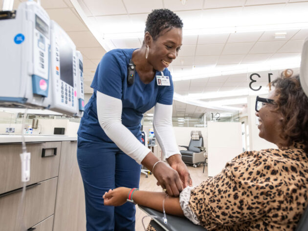 Patient receiving her treatment in the UAMS Baptist Health Infusion Center in Little Rock