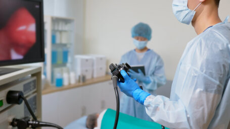 A doctor performing a colonoscopy