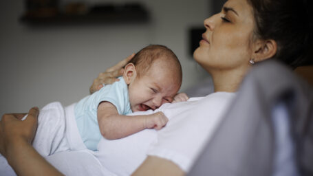 Mom with baby struggling with postpartum depression
