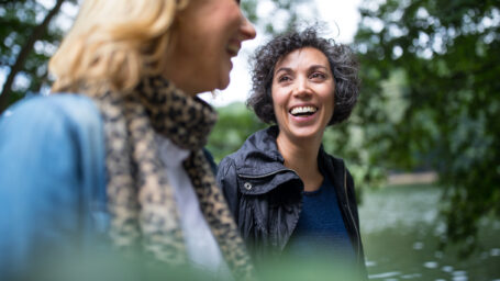 Two middle aged women taking a walk.