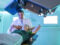 Dr. Sanjay Maraboyina with a patient in the Proton Center of Arkansas