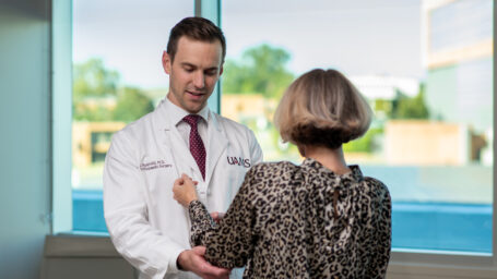 Dr. Ryan Hil working on a patients shoulder
