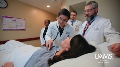 Physicians examine a patient at UAMS Southwest in Texarkana