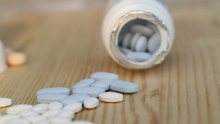 Pills scattered on a countertop