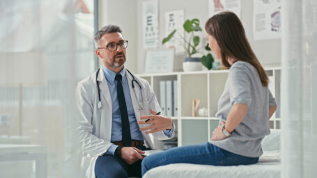 woman visiting with her primary care doctor