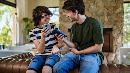 teen boys playing video games