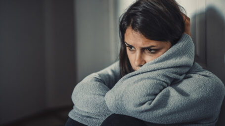 Close up of young woman struggling from mental breakdown