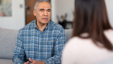 An elderly man with financial counselor